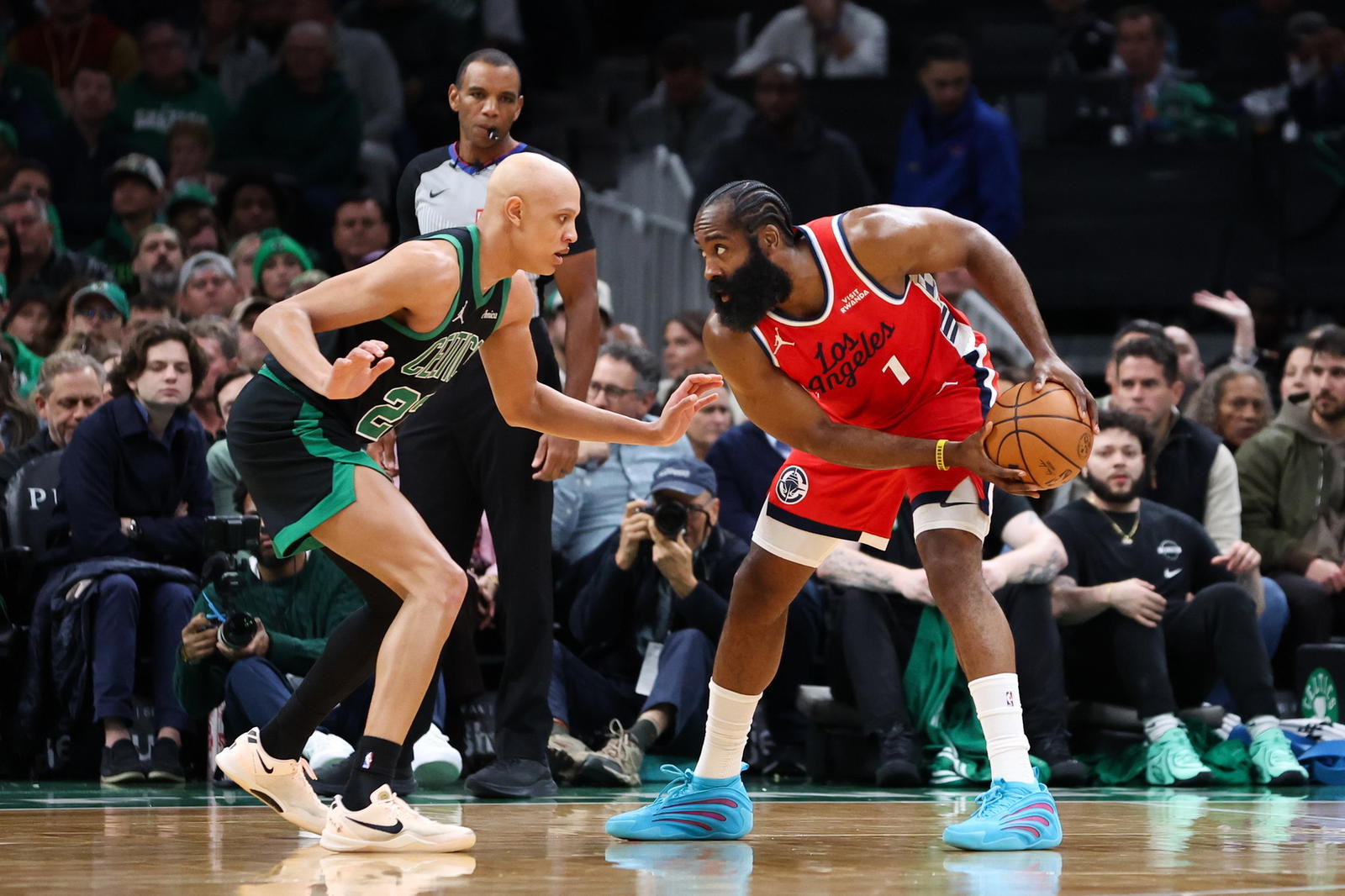 Nov 16, 2025; Boston, Massachusetts, USA; Boston Celtics forward Jordan Walsh (27) defends Los Angeles Clippers guard James Harden (1) during the first half at TD Garden. (Paul Rutherford/Imagn Images)