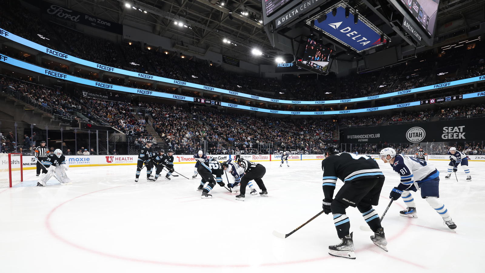 Jan 20, 2025; Salt Lake City, Utah, USA; The Winnipeg Jets and Utah Hockey Club face-off during the third period at Delta Center. Mandatory Credit: Rob Gray-Imagn Images