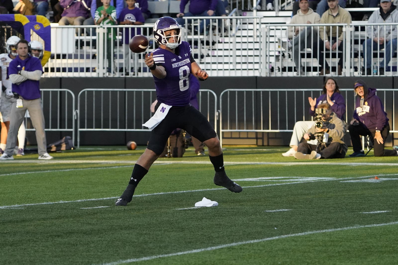 Sep 5, 2025; Evanston, Illinois, USA; Northwestern Wildcats quarterback Preston Stone (8) throws a touchdown pass against the Western Illinois Leathernecks during the first half at Northwestern Medicine Field at Martin Stadium. Mandatory Credit: David Banks-Imagn Images