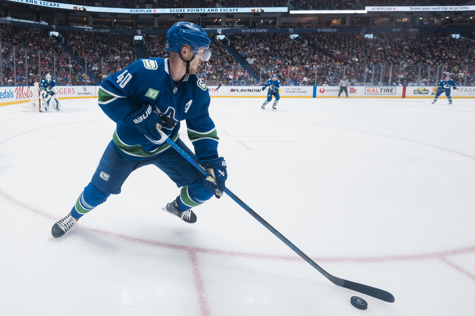 Mar 11, 2025; Vancouver, British Columbia, CAN; Vancouver Canucks forward Elias Pettersson (40) handles the puck against the Montreal Canadiens in the third period at Rogers Arena. Mandatory Credit: Bob Frid-Imagn Images