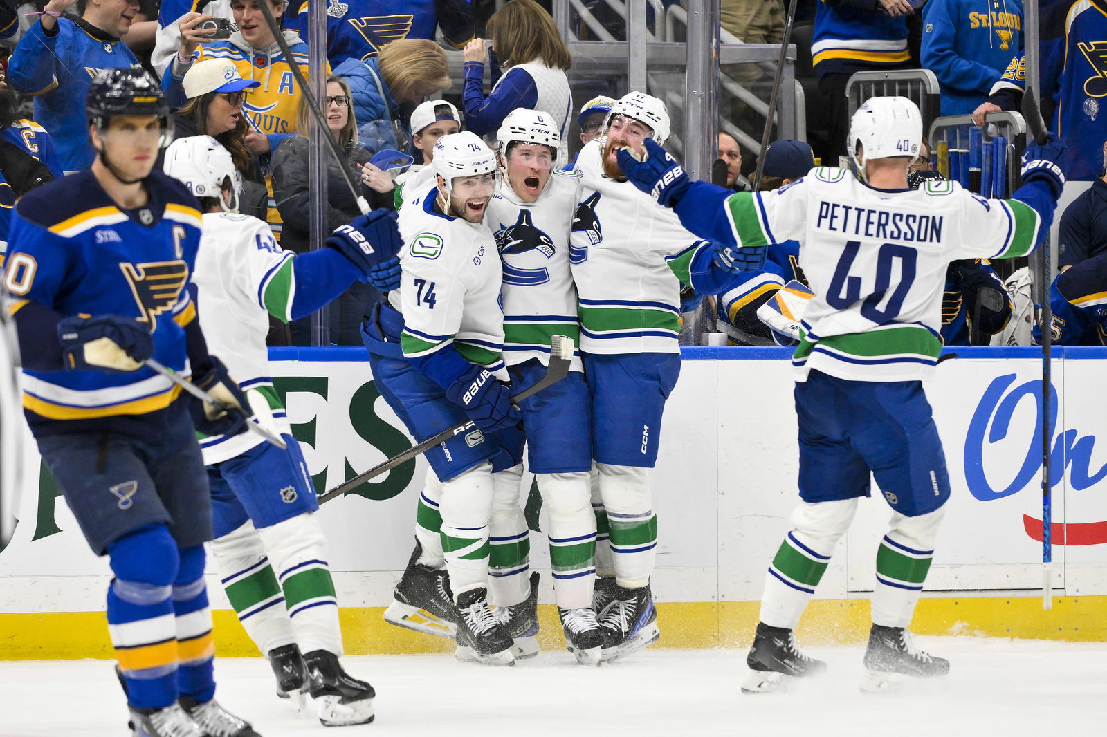 Mar 20, 2025; St. Louis, Missouri, USA; Vancouver Canucks right wing Brock Boeser (6) celebrates with left wing Jake DeBrusk (74) defenseman Filip Hronek (17) and center Elias Pettersson (40) after scoring the game tying goal against the St. Louis Blues during the third period at Enterprise Center. Mandatory Credit: Jeff Curry-Imagn Images