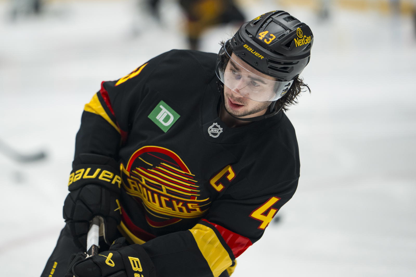 Nov 20, 2025; Vancouver, British Columbia, CAN; Vancouver Canucks forward Quinn Hughes (43) shoots during warm up prior to a game against the Dallas Stars at Rogers Arena. Mandatory Credit: Bob Frid-Imagn Images