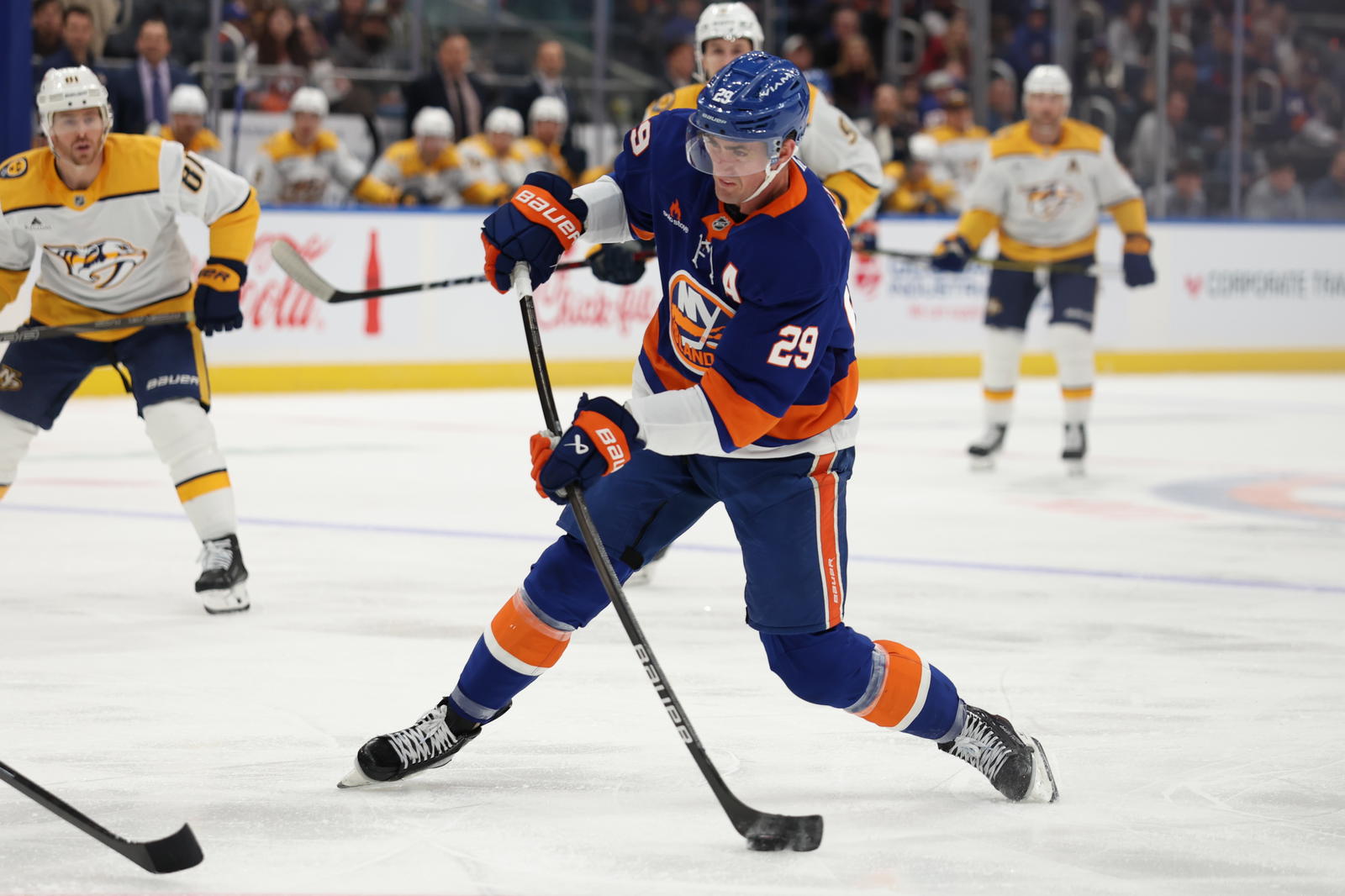 Mar 1, 2025; Elmont, New York, USA; New York Islanders center Brock Nelson (29) take a shot against the Nashville Predators during the second period at UBS Arena. Mandatory Credit: Thomas Salus-Imagn Images