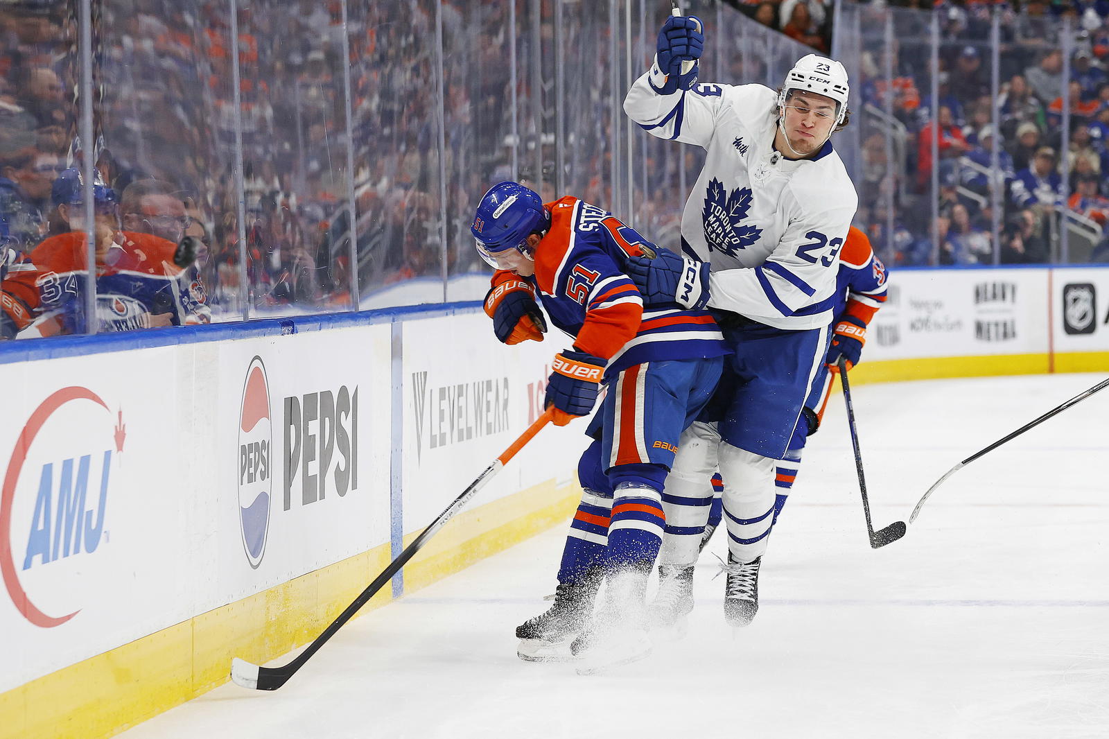 Troy Stecher and Matthew Knies (Perry Nelson-Imagn Images)