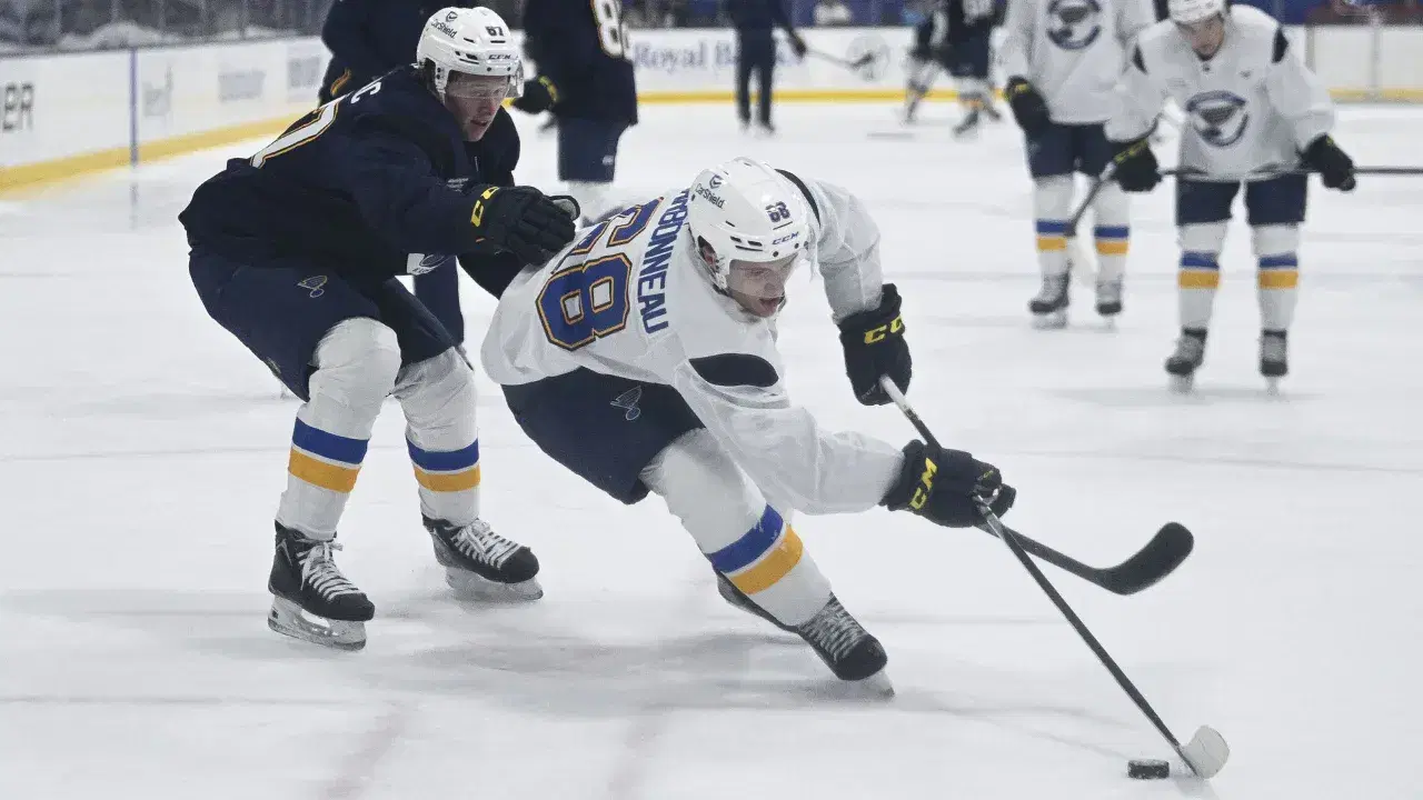 Justin Carbonneau (right), a St. Louis Blues first-round pick in 2025, is comfortable going back to junior hockey if he doesn't make NHL roster in training camp. (St. Louis Blues photo)