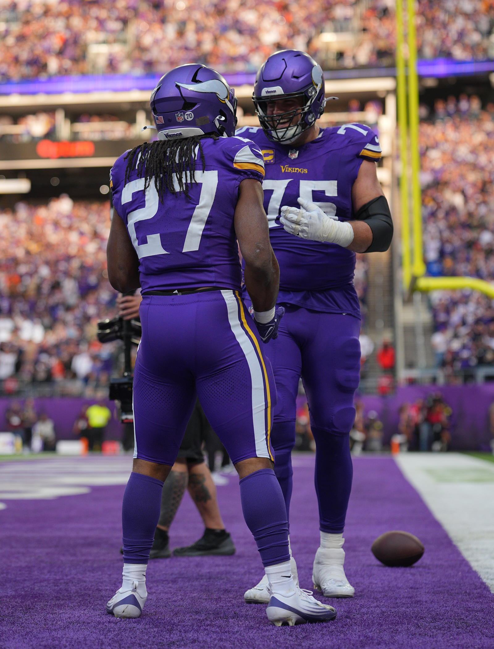 &nbsp;Minnesota Vikings running back Jordan Mason (27) celebrates a touchdown with offensive tackle Brian O'Neill (75) during the fourth quarter against the Chicago Bears at U.S. Bank Stadium.&nbsp; <br>Brad Rempel-Imagn Images