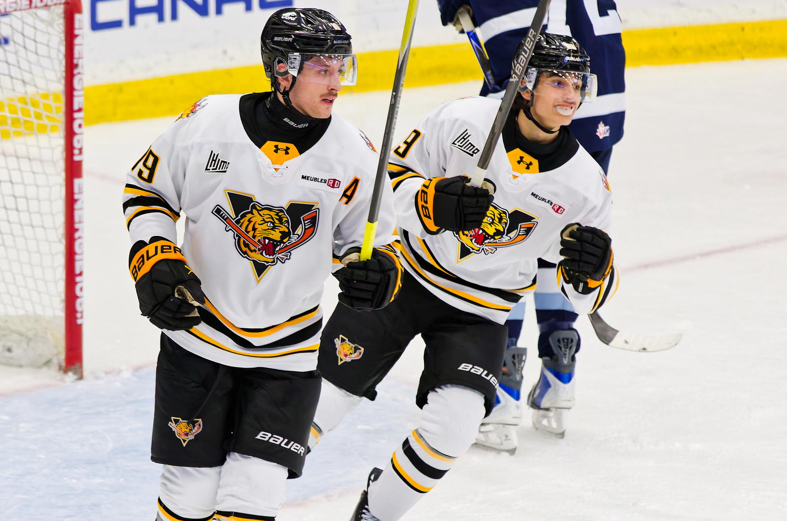 Alexis Bourque (left) and Loik Gariepy (right) celebrate after a Tigres goal Saturday. (Photo: Vincent Lévesque Rousseau)