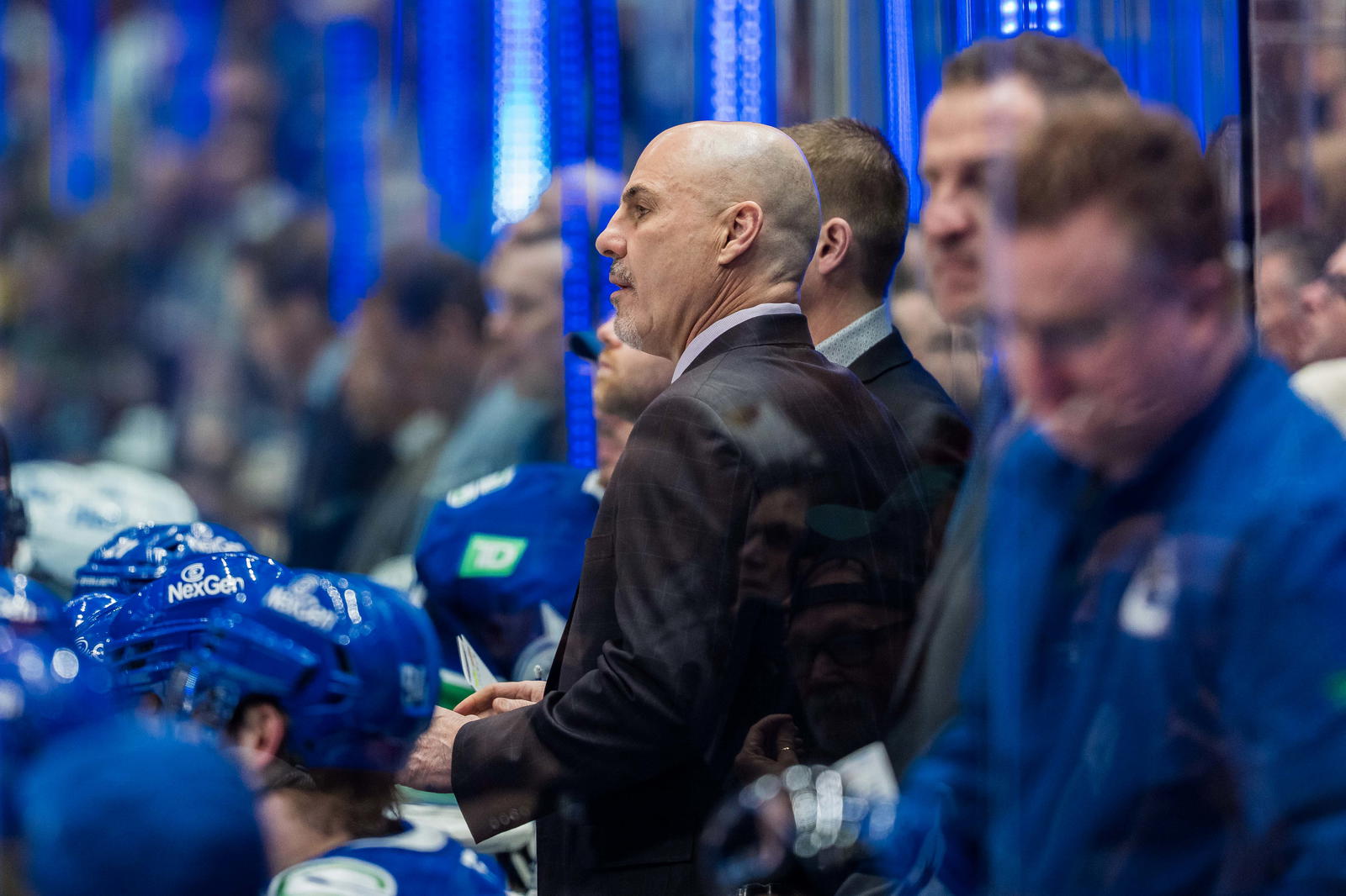 Mar 18, 2025; Vancouver, British Columbia, CAN; Vancouver Canucks head coach Rick Tocchet on the bench against the Winnipeg Jets in the third period at Rogers Arena. Mandatory Credit: Bob Frid-Imagn Images