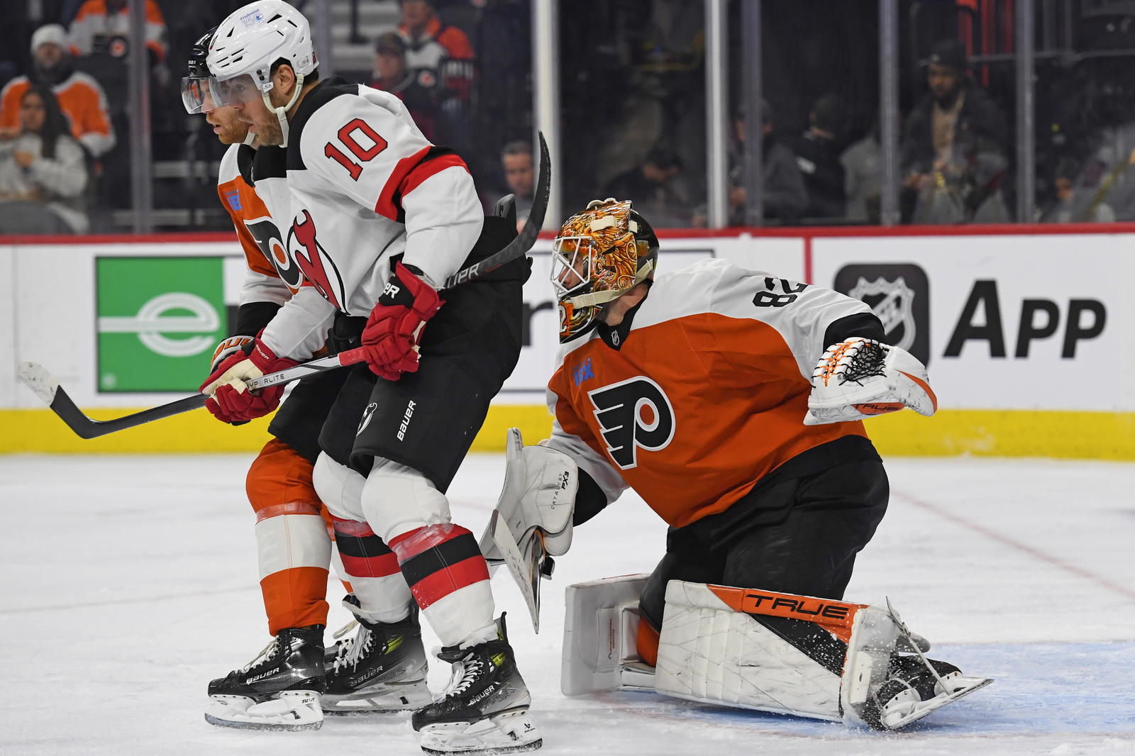 Mar 9, 2025; Philadelphia, Pennsylvania, USA; Philadelphia Flyers goaltender Ivan Fedotov (82) is screened by New Jersey Devils right wing Daniel Sprong (10) during the second period at Wells Fargo Center. Mandatory Credit: Eric Hartline-Imagn Images