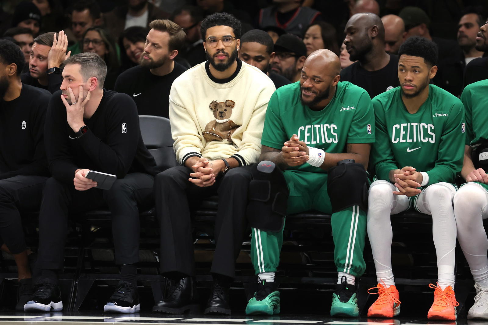 Nov 18, 2025; Brooklyn, New York, USA; Boston Celtics injured forward Jayson Tatum (0) watches from the bench during the third quarter against the Brooklyn Nets at Barclays Center. (Brad Penner/Imagn Images)