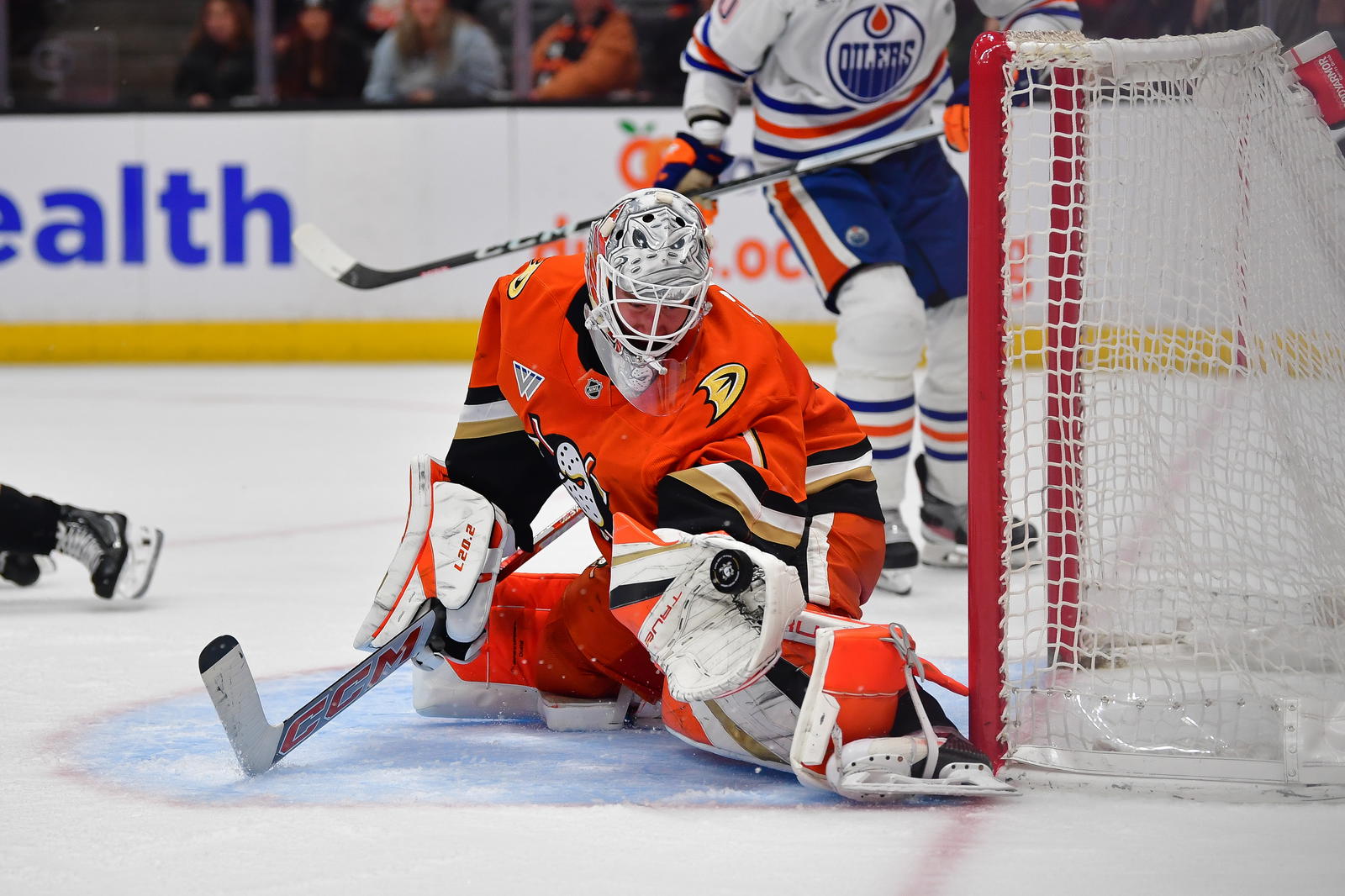 Apr 7, 2025; Anaheim, California, USA; Anaheim Ducks goaltender Lukas Dostal (1) blocks a shot against the Edmonton Oilers during the third period at Honda Center. Mandatory Credit: Gary A. Vasquez-Imagn Images