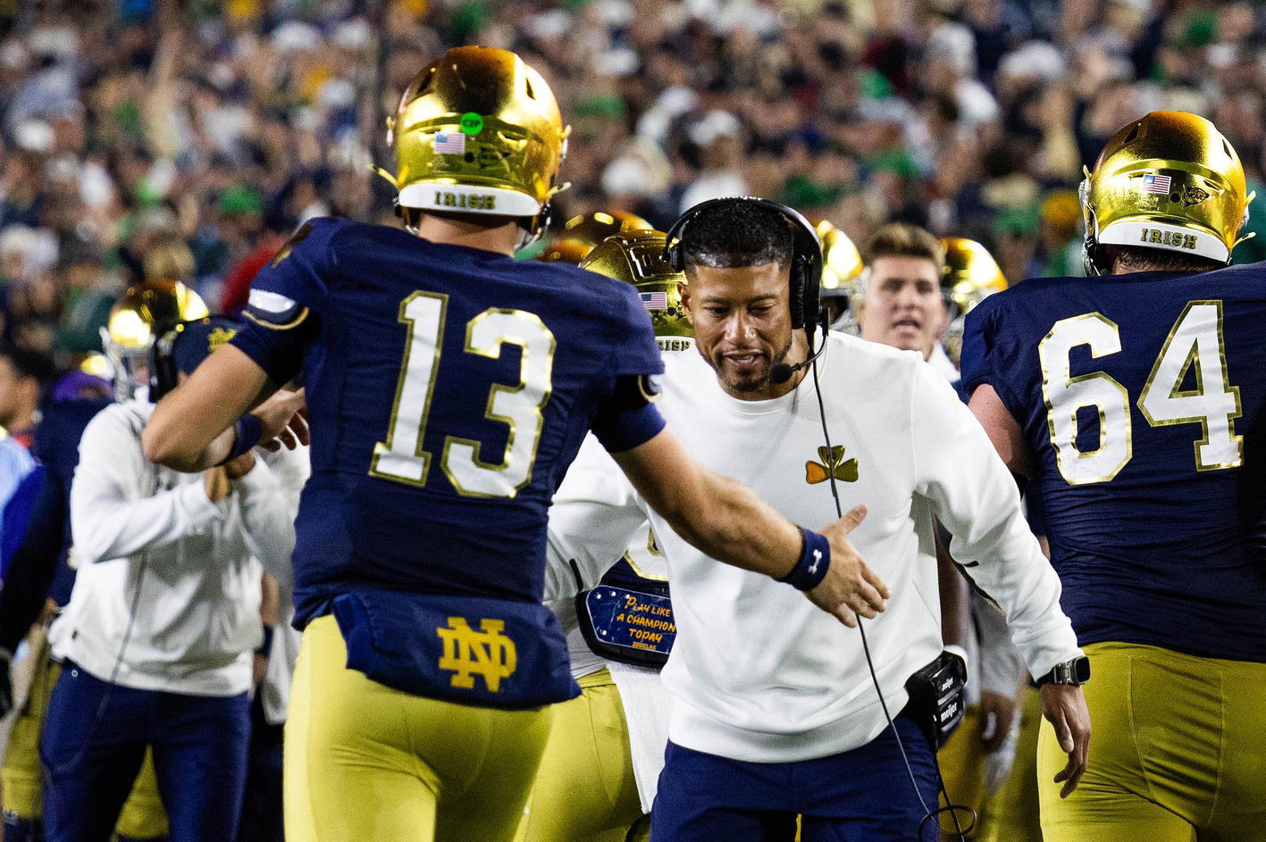 Marcus Freeman congratulates his quarterback in Notre Dame's win over USC. Photo courtesy Trevor Ruszkowski-Imagn Images