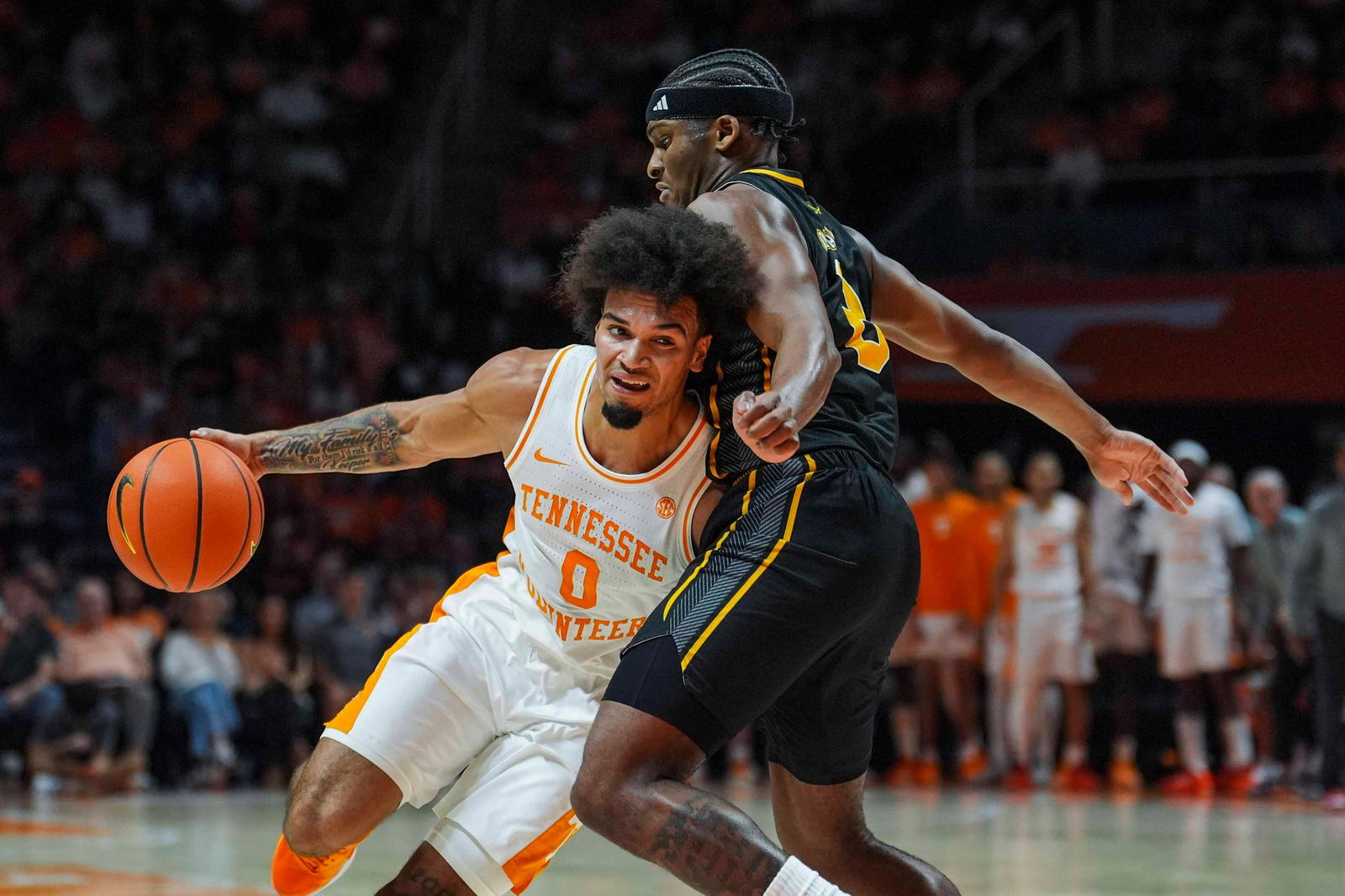 Tennessee guard Ja'Kobi Gillespie (0) goes around Northern Kentucky guard Donovan Oday (8) during a NCAA basketball game between the Tennessee Volunteers and Northern Kentucky Norse at Thompson-Boling Arena at Food City Center on Nov. 8, 2025. (ANGELINA ALCANTAR/Imagn Images)
