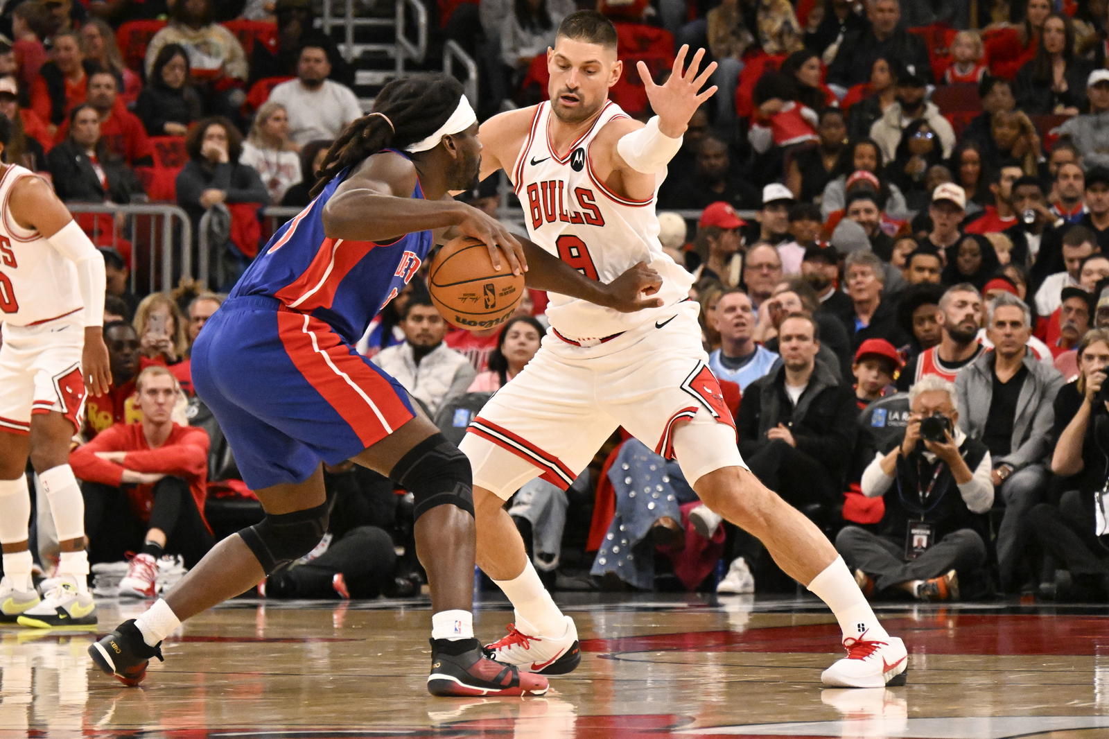 Oct 22, 2025; Chicago, Illinois, USA; Chicago Bulls center Nikola Vucevic (9) defends against Detroit Pistons forward Isaiah Stewart (28) during the first half at United Center. Mandatory Credit: Matt Marton-Imagn Images