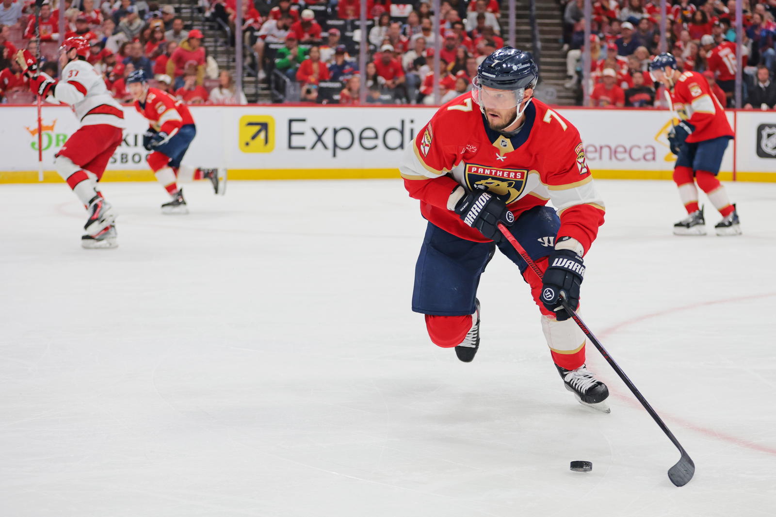 May 24, 2025; Sunrise, Florida, USA;Florida Panthers defenseman Dmitry Kulikov (7) controls the puck during the third period against the Carolina Hurricanes in game three of the Eastern Conference Final of the 2025 Stanley Cup Playoffs at Amerant Bank Arena. Mandatory Credit: Sam Navarro-Imagn Images