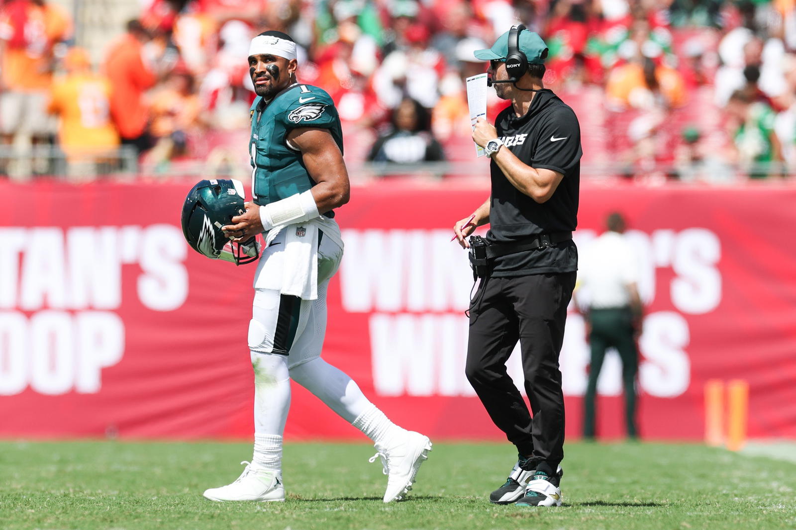 Philadelphia Eagles offensive coordinator Kevin Patullo speaks to quarterback Jalen Hurts. Credit: Nathan Ray Seebeck-Imagn Images.
